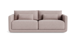 An 85-inch Eva sofa in beige, showcasing clean lines and a minimalist design with two large seat and back cushions, set against a plain black background.