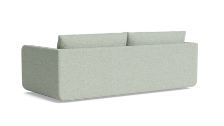 The Eva 85" Sofa is a minimalist piece with a boxy design in light gray, featuring two back cushions. Against a black background, its clean lines and modern aesthetic are perfectly highlighted.