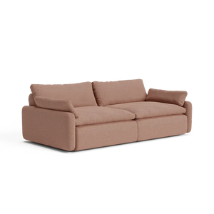 Introducing The Sink Down Sectional: a plush, brown fabric sectional with thick cushions and wide armrests crafted for ultimate comfort. Featuring a modern, boxy design, this sofa comfortably seats three people and sits on a flat surface, exuding a cozy and inviting vibe.