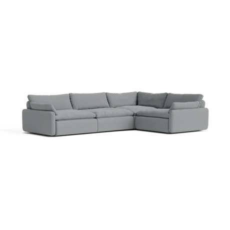 The Sink Down Sectional is a large, gray, L-shaped sofa with thick cushions and a modern design, placed against a plain background.