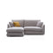 The Feathers 88" Left Facing Sectional is a modern grey sectional sofa featuring two large seat cushions and three matching grey cushions. To add a pop of color, there's a single mustard yellow cushion, all set against a white background.