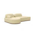 The Magna Preconfigured Sectional is a modern beige sofa with a low backrest and plush cushions, characterized by its smooth curves and minimalist design. It features a thin, flat base that enhances its contemporary and stylish appearance.