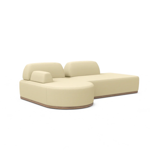 The Magna Preconfigured Sectional is a modern beige sofa with a low backrest and plush cushions, characterized by its smooth curves and minimalist design. It features a thin, flat base that enhances its contemporary and stylish appearance.
