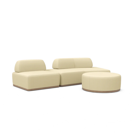 Introducing the Magna Preconfigured Sectional: a modular beige sofa set featuring three cushioned sections and a round ottoman. Its design boasts a minimalistic style with elegant wooden bases.