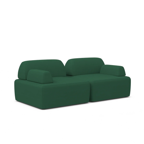 The Magna Preconfigured Sectional is a contemporary-styled, modern sofa featuring wide cushions and a low backrest in a minimalist green design. It boasts blocky armrests and an elegantly sleek appearance, set against a plain white background.