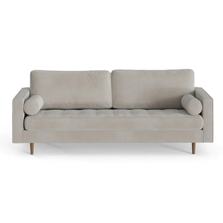 The Geo 84'' Upholstered Sofa is a contemporary piece in light gray, featuring two seat cushions and two large rectangular back cushions. It is designed with cylindrical bolster pillows on each armrest and stands on wooden legs, all set against a white background.