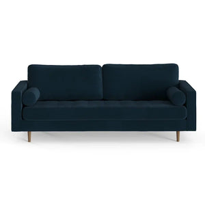 The Geo 84'' Upholstered Sofa is a modern three-seater in dark blue, designed with two back cushions and two cylindrical bolster pillows on each end. It showcases a minimalist style with wooden legs and is set against a white background.
