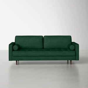 The Geo 84'' Upholstered Sofa, featuring a dark green modern design with wooden legs and two cylindrical cushions, is set against a plain, light-colored background.
