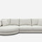 A modern, light gray sectional sofa with a curved chaise on the left side. It features thick cushions and is paired with four matching throw pillows, all set against a plain white background.