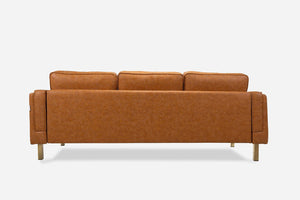 Back view of an Albany Sofa (Vegan Leather) in brown, featuring three cushions and standing on four wooden legs against a plain white background.