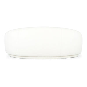 A large, round Excelsior Sofa Cream ottoman features a smooth, cushioned surface. Its minimalistic design makes it suitable for modern interiors, and it stands out against a plain white background.