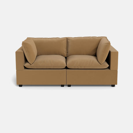 The Kova Pillow Cushion Sofa 86" is a modern, tan two-seater with plush cushions and square arms, shown against a plain white background.