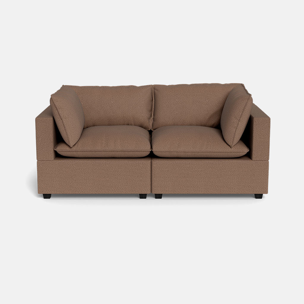 The Kova Pillow Cushion Sofa 86" is a modern brown two-seater with square armrests and two large seat cushions, displayed against a plain white background.