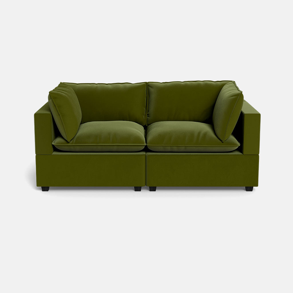 The Kova Pillow Cushion Sofa 86" is a modern, boxy loveseat in olive green with plush cushions and a minimalist design, shown against a plain white background.