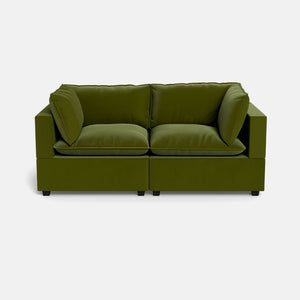 The Kova Pillow Cushion Sofa 86" is a modern, boxy loveseat in olive green with plush cushions and a minimalist design, shown against a plain white background.