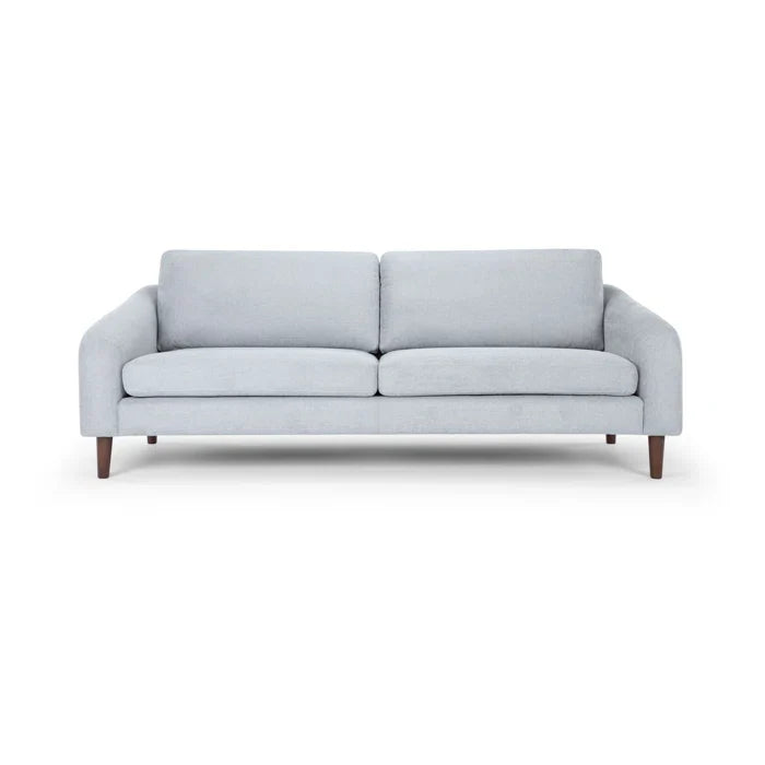Introducing the Lana 85'' Upholstered Sofa: This minimalist piece comes in a light gray finish and captures mid-century modern style with its wooden legs. The sofa is designed with two seat cushions and two backrest cushions for ultimate comfort.