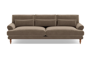 Maxwell Custom Sofa in brown velvet, featuring three seat cushions and three matching throw pillows. It boasts rounded armrests and wooden legs for a classic and cozy design.