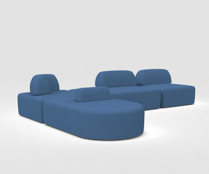 The Magna Preconfigured Sectional, shown on a white background, is an L-shaped modular blue sofa featuring rounded cushioned backs and seats with sections at different heights for versatile seating.
