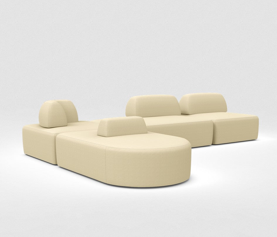 The Magna Preconfigured Sectional is a minimalist, beige modular sofa with rounded edges and adjustable backrests, set against a plain white background. It features separate segments that can be rearranged for various seating configurations.