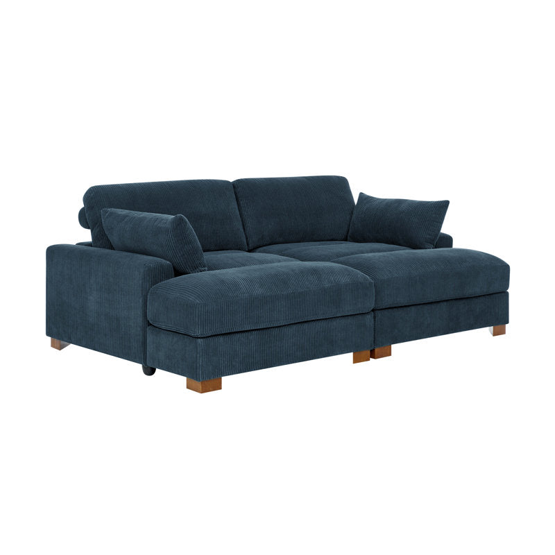 The Etta Avenue Mordecai 90'' Square Arm Sofa is a plush, L-shaped sectional in dark blue, featuring wooden legs and loose back cushions. Displayed against a white background, its soft, textured fabric enhances the comfort and modern design.