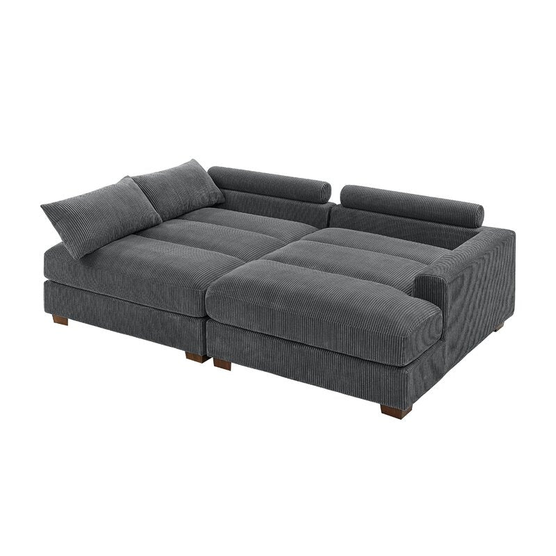 The Etta Avenue Mordecai 90'' Square Arm Sofa is a modular grey corduroy piece with low backrests and cushions. It boasts a square shape with deep seating, wooden block legs, and a plush, textured surface, offering comfort and relaxation.