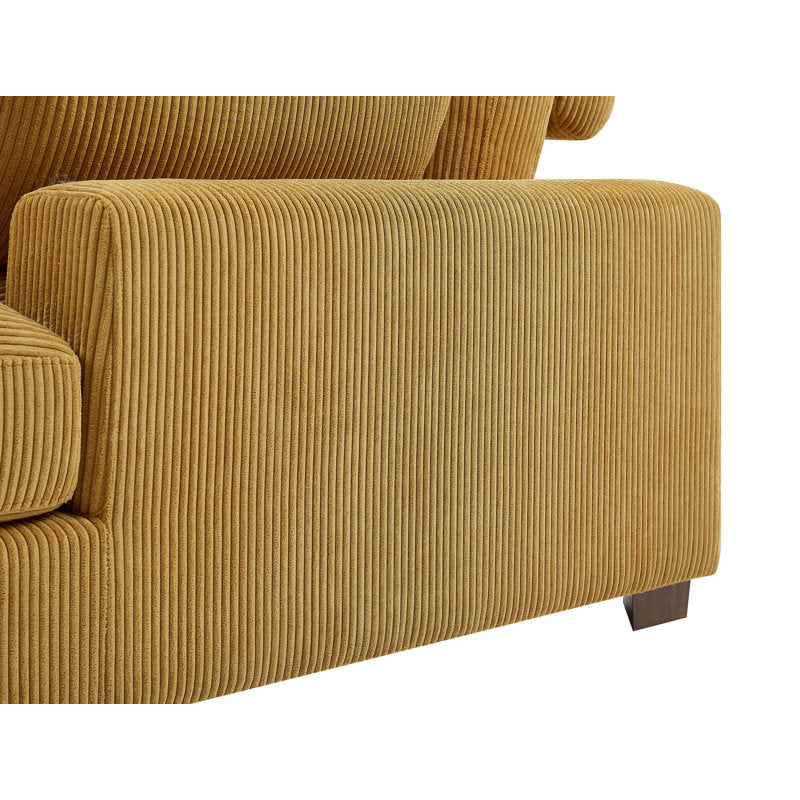 Close-up of an Etta Avenue Mordecai 90'' Square Arm Sofa in mustard-colored corduroy, showcasing a textured pattern on the armrest. This modern design features short, dark wooden legs and is set against a white background.