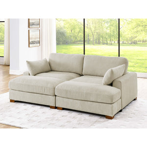 The Etta Avenue Mordecai 90'' Square Arm Sofa in beige corduroy with wooden legs is positioned on a light-colored rug in a bright room. Large windows in the background unveil a lush green outdoor scene, enhancing the cozy and inviting atmosphere.