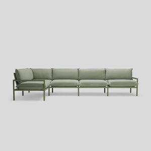 The Terra Sectional is a minimalist green sofa featuring five seat cushions and matching back cushions on a sleek metal frame, set against a plain white background.