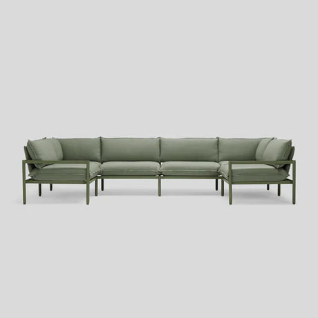 Terra Sectional, an L-shaped outdoor sofa with cushioned seats and an aluminum frame in green, set against a plain light gray background.
