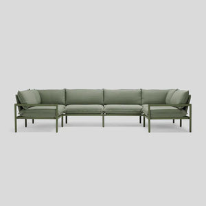 Terra Sectional, an L-shaped outdoor sofa with cushioned seats and an aluminum frame in green, set against a plain light gray background.