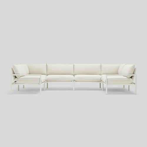The Terra Sectional is a white, modern sofa with a metal frame and cushioned seats, organized in an L-shape on a light gray background.