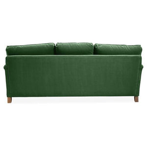 The Brooke 6-Seat Sofa, pictured from the rear, showcases a straightforward, modern design with three plush seat cushions and wooden legs in a green hue.