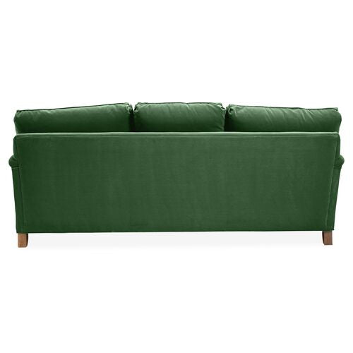 The Brooke 6-Seat Sofa, pictured from the rear, showcases a straightforward, modern design with three plush seat cushions and wooden legs in a green hue.