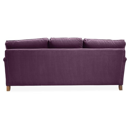 The Brooke 6-Seat Sofa, seen from the rear view, features a sleek, modern design with three cushion backs in a purple hue and wooden legs.