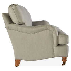Side view of the Brooke 6-Seat Sofa in light gray upholstery, showcasing curved wooden legs with a small wheel on the front leg, and offering a cushioned back and seat for enhanced comfort.