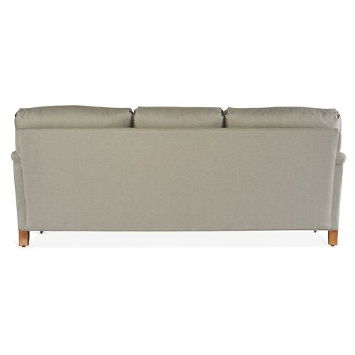 Back view of the Brooke 6-Seat Sofa in light gray, featuring three cushioned sections and wooden legs, set against a white background.