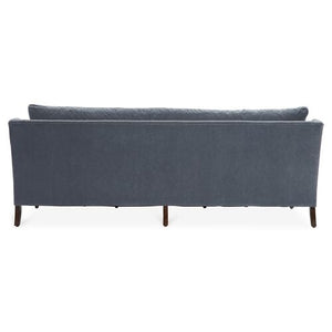 Back view of the Margot Velvet Sofa, highlighting its sleek and minimalist design with wooden legs.