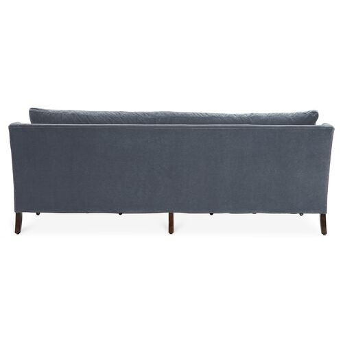 Back view of the Margot Velvet Sofa, highlighting its sleek and minimalist design with wooden legs.