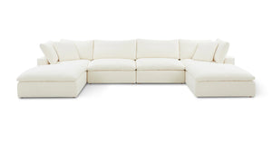 The Movie Night 3-Piece Modular Sofa, an expansive white L-shaped sectional with plush cushions, is set against a simple backdrop. Its modern and minimalist design features deep seating and padded armrests, creating a cozy and inviting look.