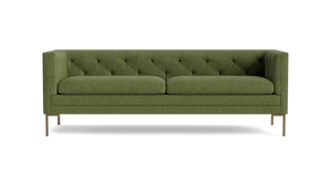 Product: Sit Tight 90" Sofa - A green tufted design featuring two seat cushions and wooden legs, presented against a black backdrop.
