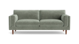 The Skinny Fat 85" Sofa Standard Depth is a stylish, modern sofa in green, featuring two matching cylindrical cushions and wooden legs, set against a plain black background.