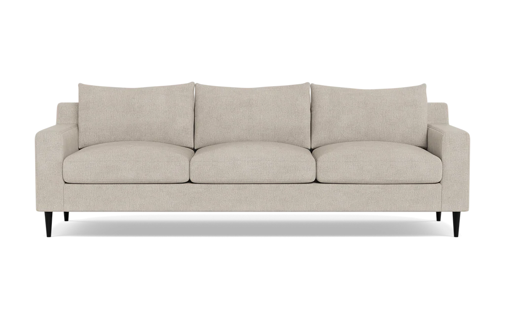 The Sloan Custom 3-Seat 95" Sofa, featuring plush cushions and sleek black legs, is displayed against a plain background. Its simple and modern design offers a contemporary look.