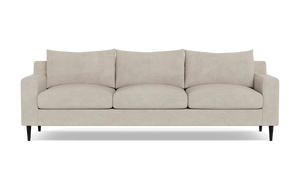 The Sloan Custom 3-Seat 95" Sofa, featuring plush cushions and sleek black legs, is displayed against a plain background. Its simple and modern design offers a contemporary look.