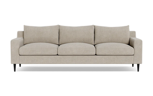 The Sloan Custom 3-Seat 95" Sofa is a beige, three-seater piece featuring clean lines and a modern design. It includes three large seat cushions and three matching back cushions. The sofa is styled with short, black legs and embodies a minimalist aesthetic, perfect for contemporary interiors.