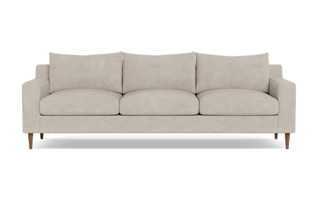 The Sloan Custom 3-Seat 95" Sofa is a modern beige sofa featuring streamlined, rectangular cushions and slim wooden legs, positioned against a plain black background.