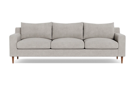 The Sloan Custom 3-Seat 95" Sofa features a modern design with a light gray finish, encompassing three seat cushions and three back cushions. Its clean, simple lines and wooden legs contribute to its minimalist and stylish look. The sofa is presented against a plain black background.