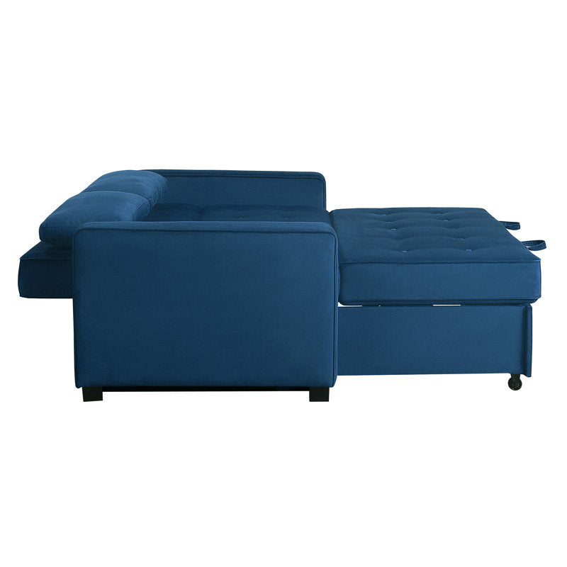 Introducing the Serta Monroe Full Size Convertible Sofa: This blue L-shaped sectional features tufted cushions with one section extending outward to create a chaise lounge effect. The plush fabric and small dark legs make it an elegant addition to any room.