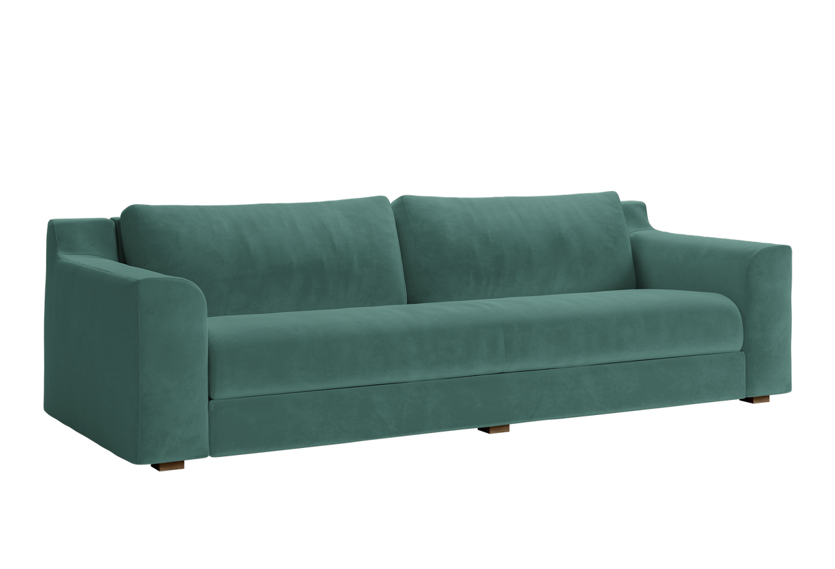 The Elevate Sofa is a sleek, modern piece with plush cushions and low armrests, presented against a plain white background. Its minimalist design boasts a smooth fabric finish and sturdy block legs.