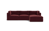 The Tatum Modular 3 Seat Chaise 106" Sectional, with its maroon upholstery and plush cushions, is showcased against a solid black backdrop. This stylish design includes three connected seats and a chaise lounge positioned on the right side.