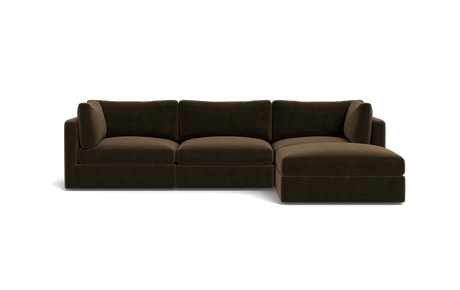 The Tatum Modular 3 Seat Chaise 106" Sectional is a dark brown piece featuring three seat cushions and a chaise lounge on the right. It boasts clean lines and a plush appearance, set against a plain black background.